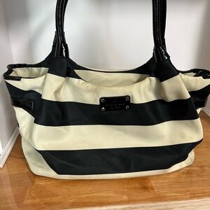 Kate Spade New York Black & Cream striped nylon Stevie bag.